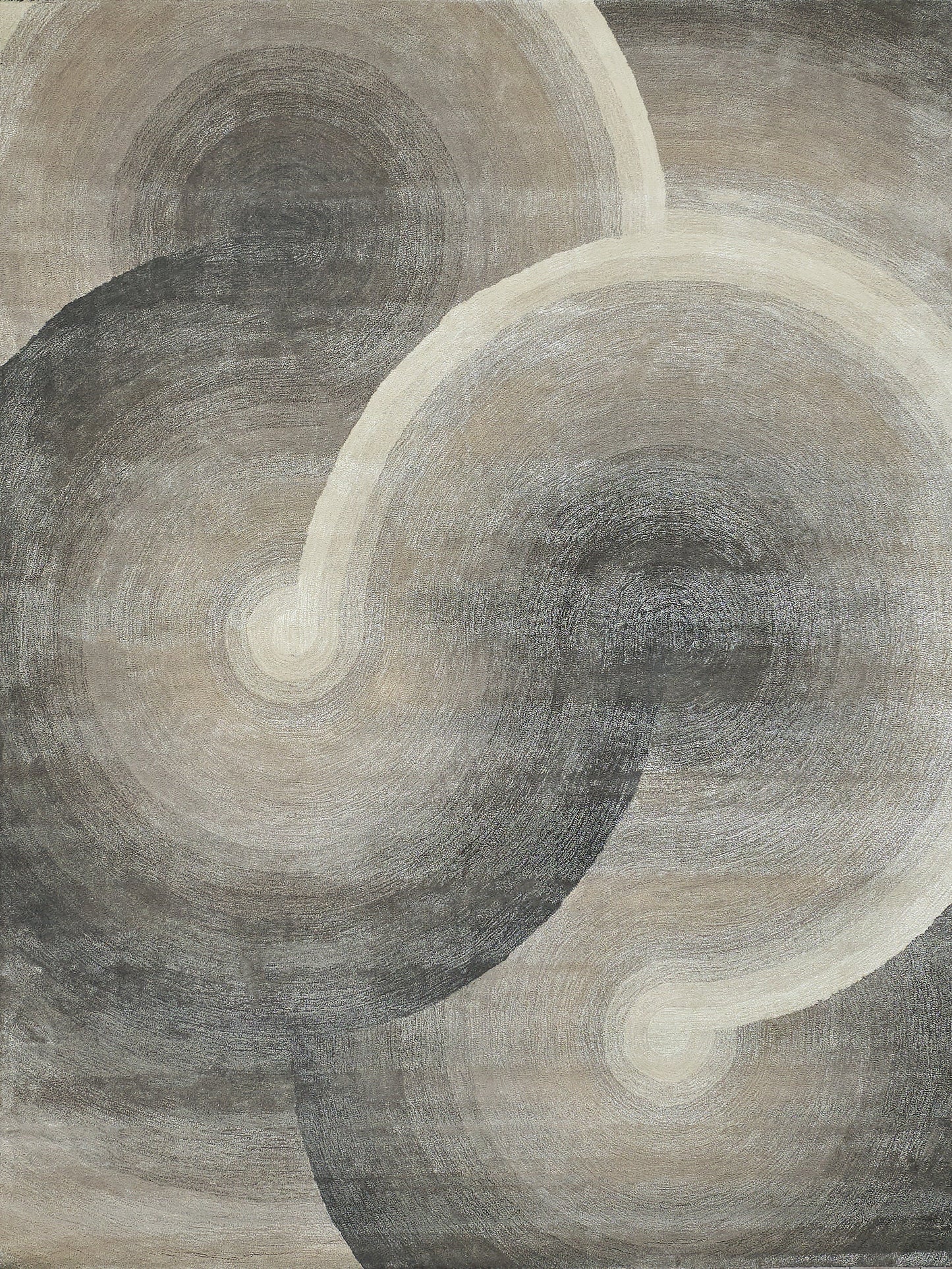 Abstract circular swirl area rug in muted gray, taupe, and ivory tones; modern geometric pattern.