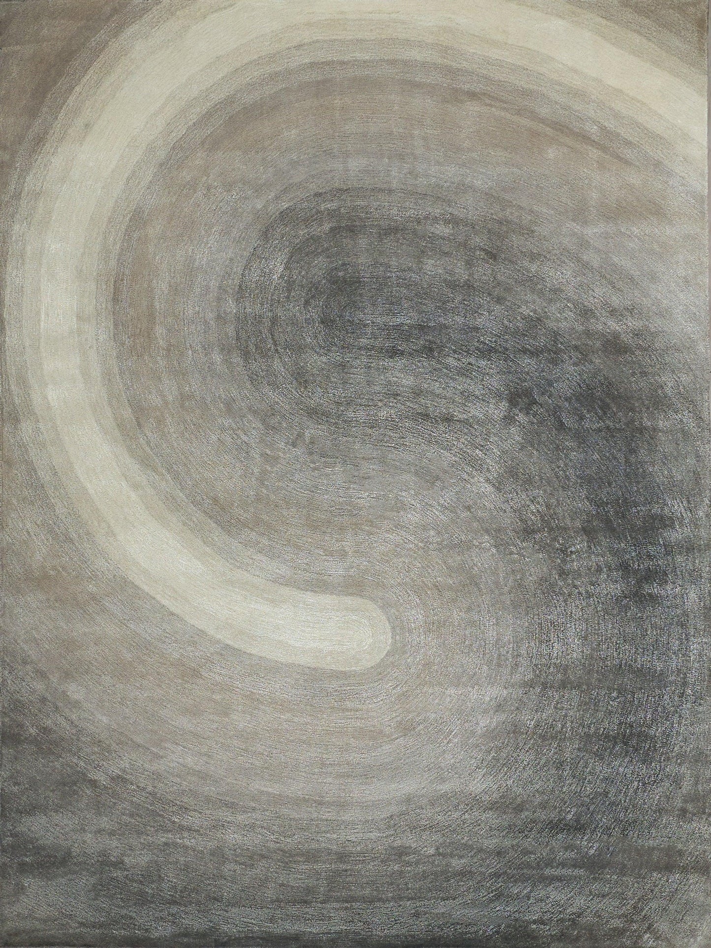 Textured abstract rug in beige and gray with concentric circles and a pale cream arc.