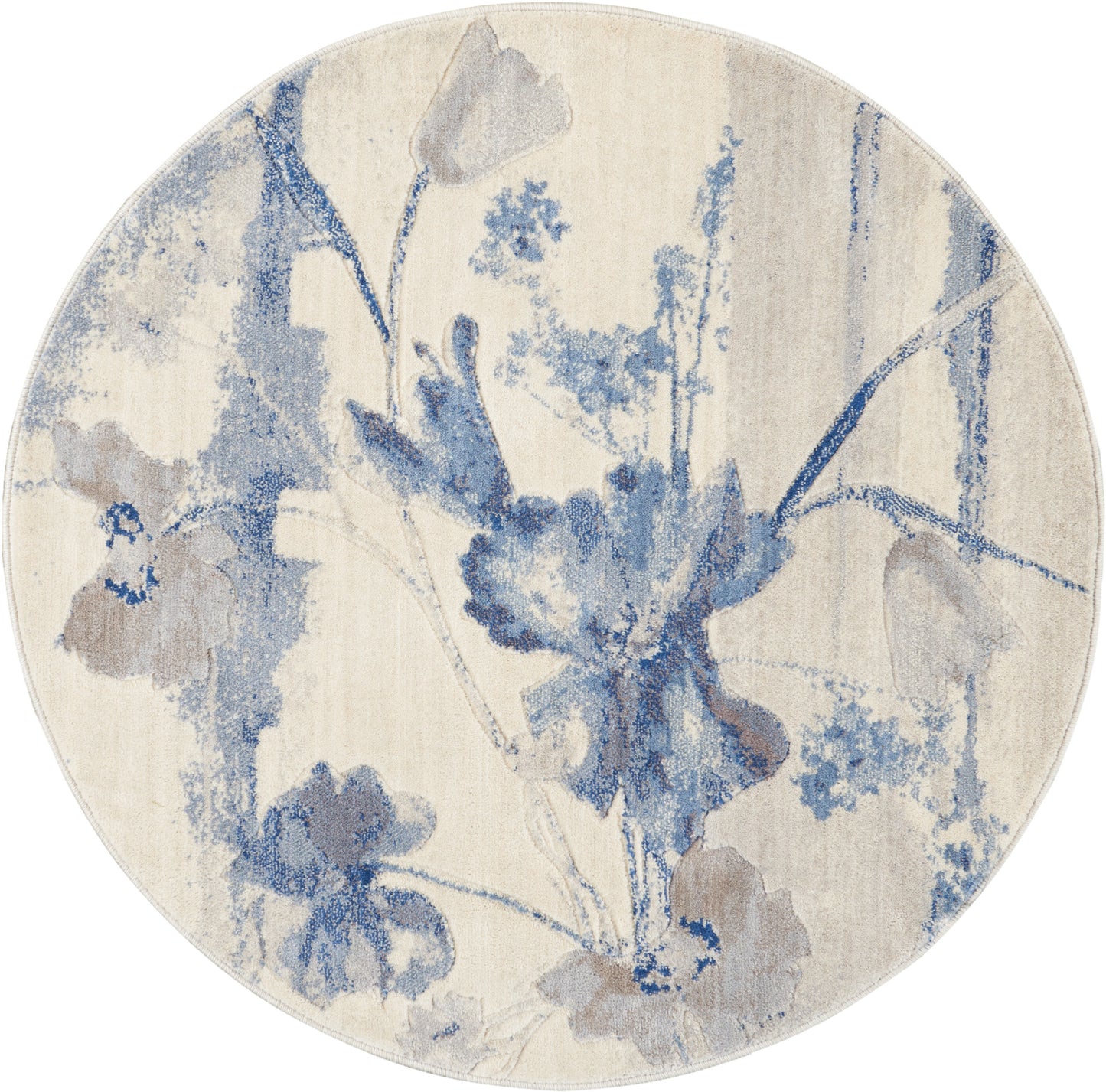 Round beige rug with blue watercolor floral pattern; soft decorative floor accent.