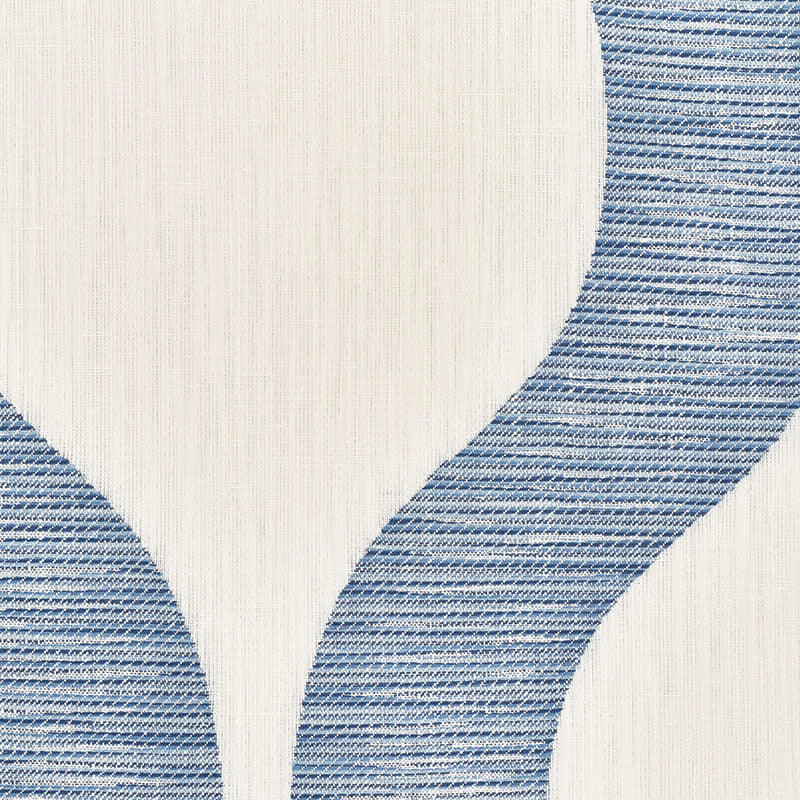 Beige woven rug with curved denim-blue stripes forming an abstract pattern.