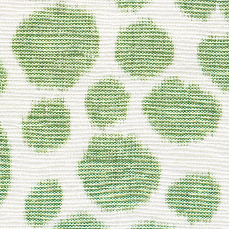 Mint green circular polka dots on cream knit fabric; textured, casual textile print.