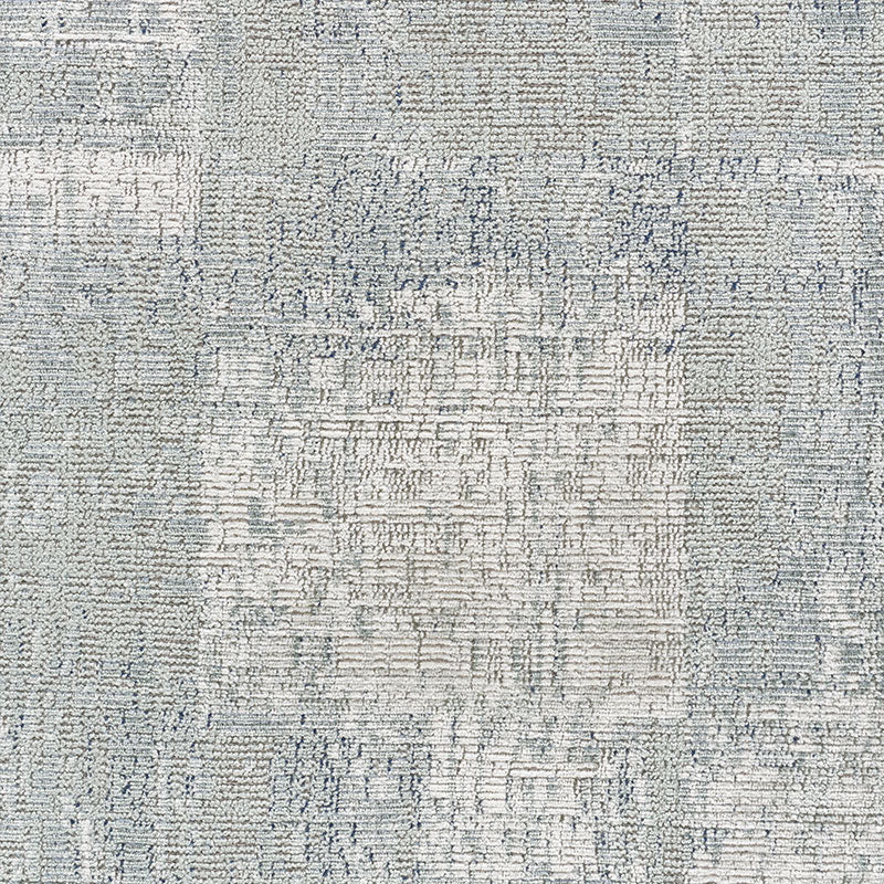 Light gray-blue woven area rug with subtle geometric pattern and textured surface; rectangular, modern style.