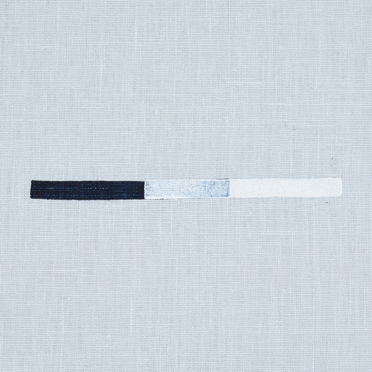 Textile print showing overlapping dash motifs in sky blue on a pale linen background