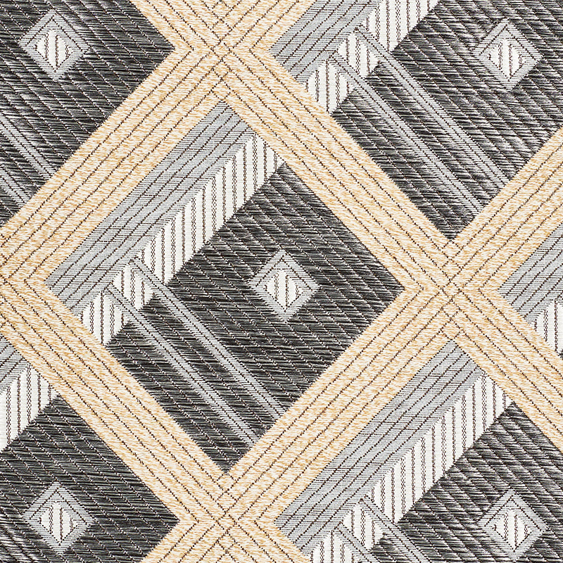 Woven geometric rug featuring beige, gray and charcoal diamonds in a lattice/chevron pattern.