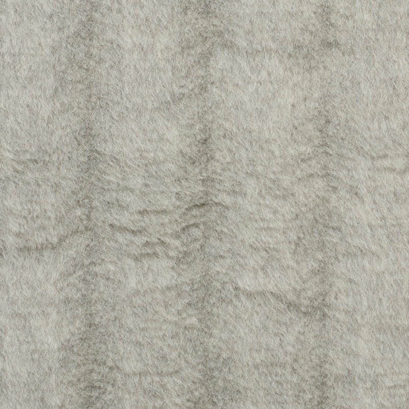 Beige plush fabric with soft nap and subtle textured surface.