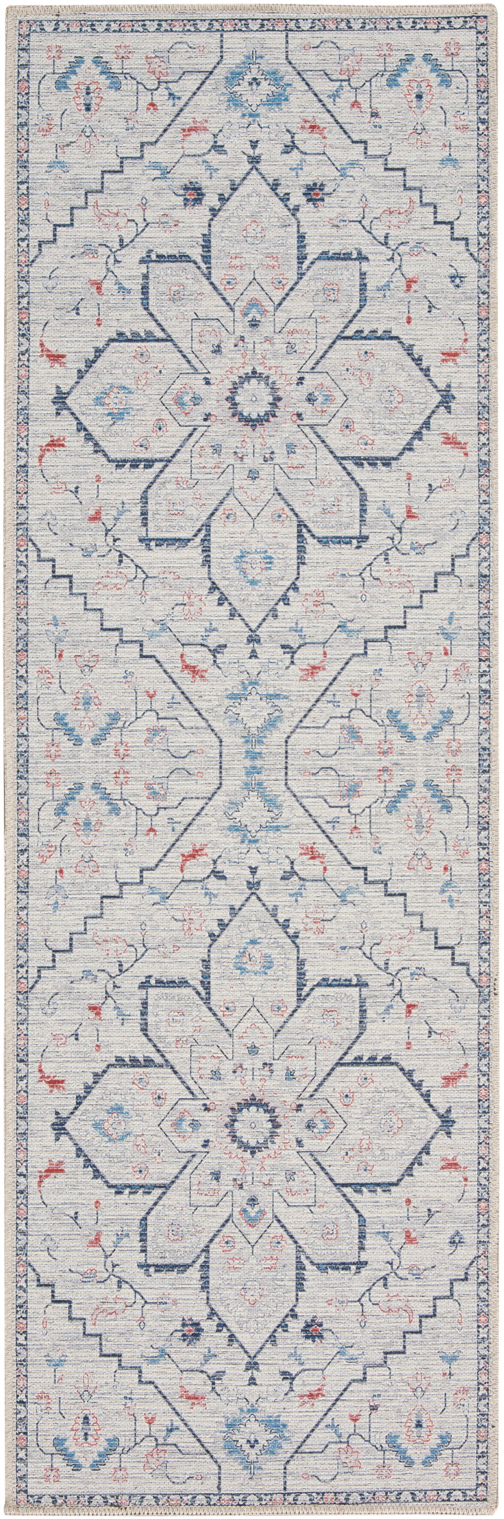 Ivory farmhouse-style runner rug with navy geometric medallions and blue and red floral accents, bordered trim.