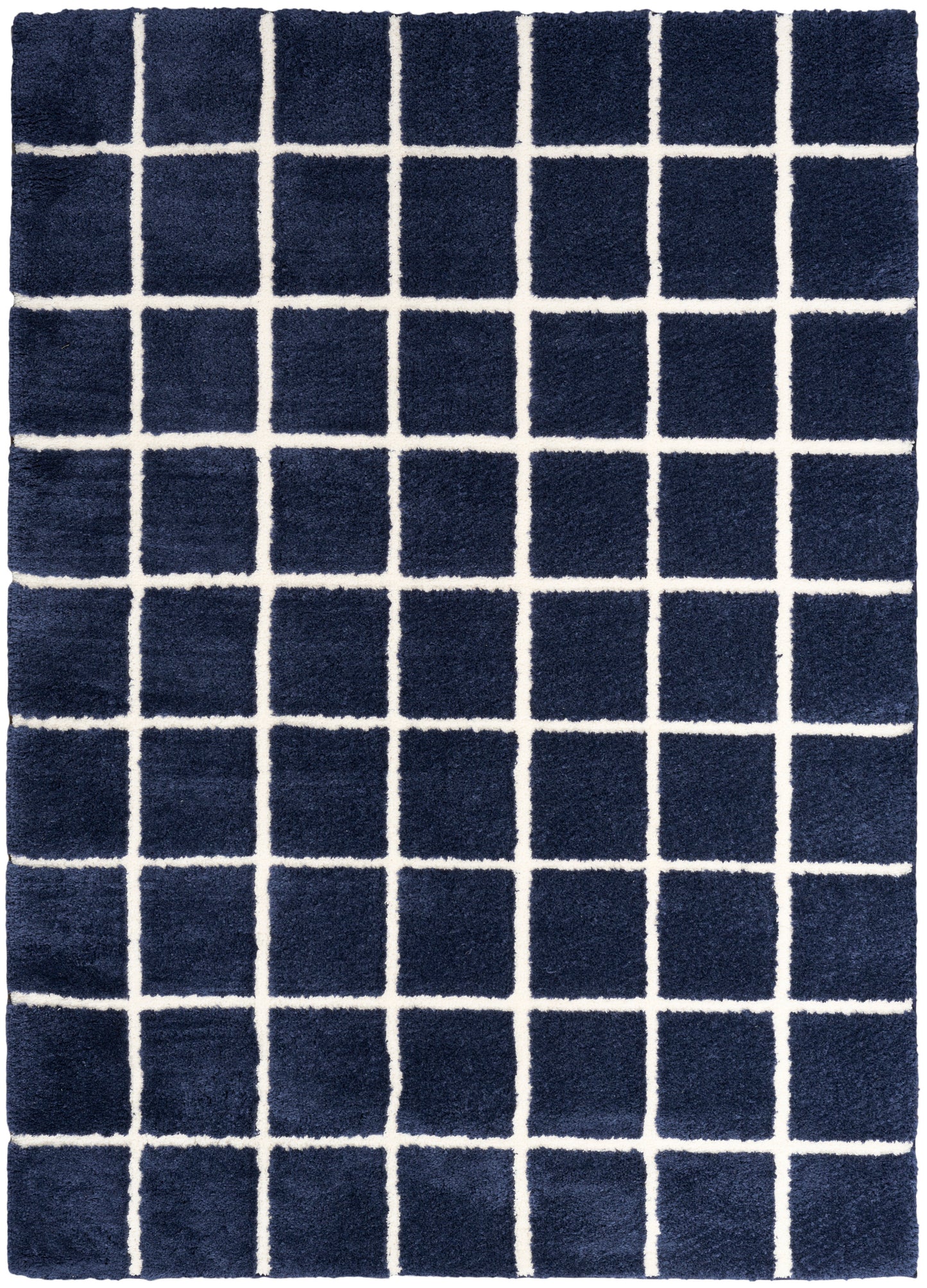 Navy blue shag rug with white grid squares; plush texture, rectangular area rug for living room or bedroom.