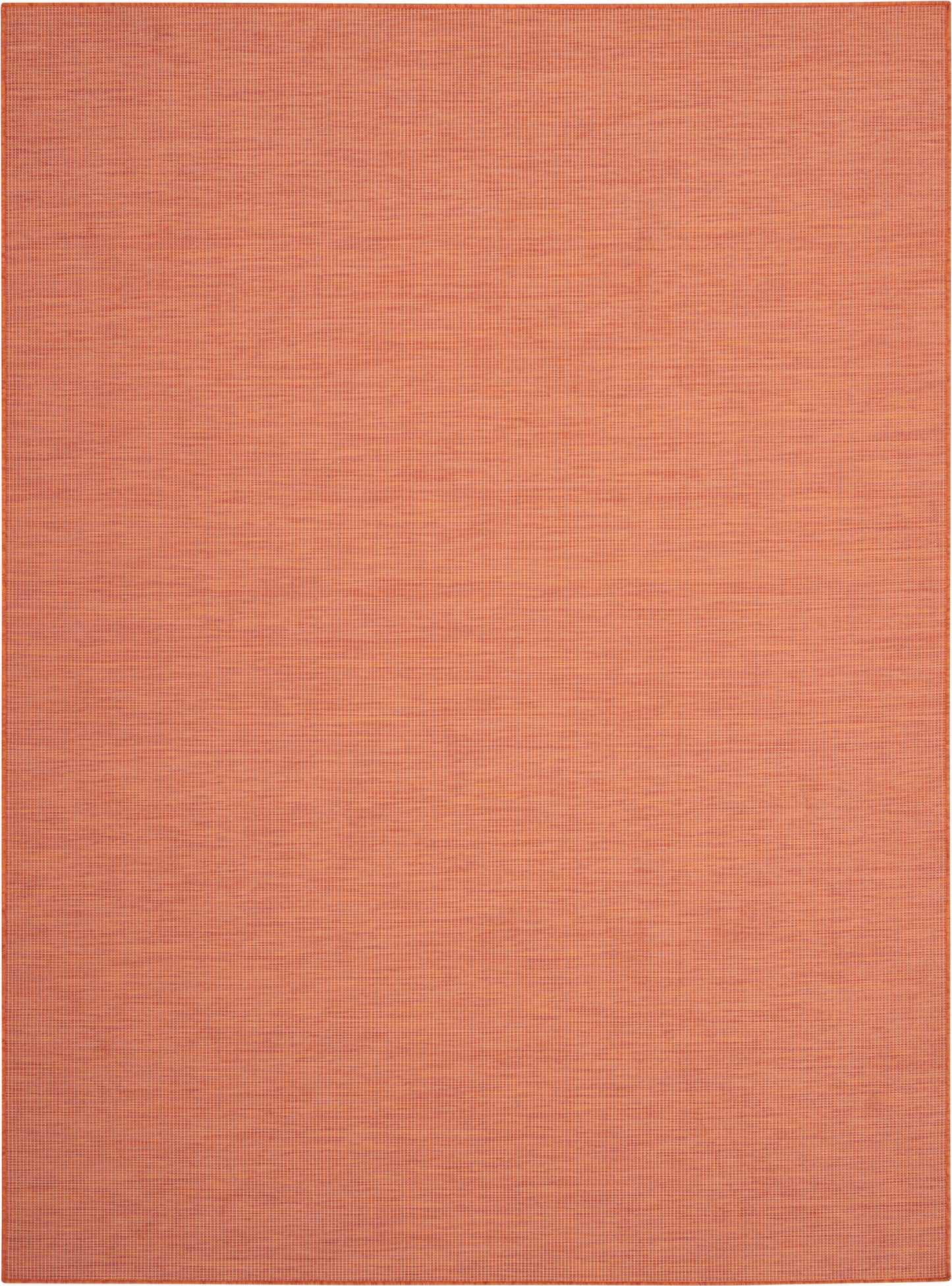 Orange woven rug with subtle grid texture in warm terracotta tones.
