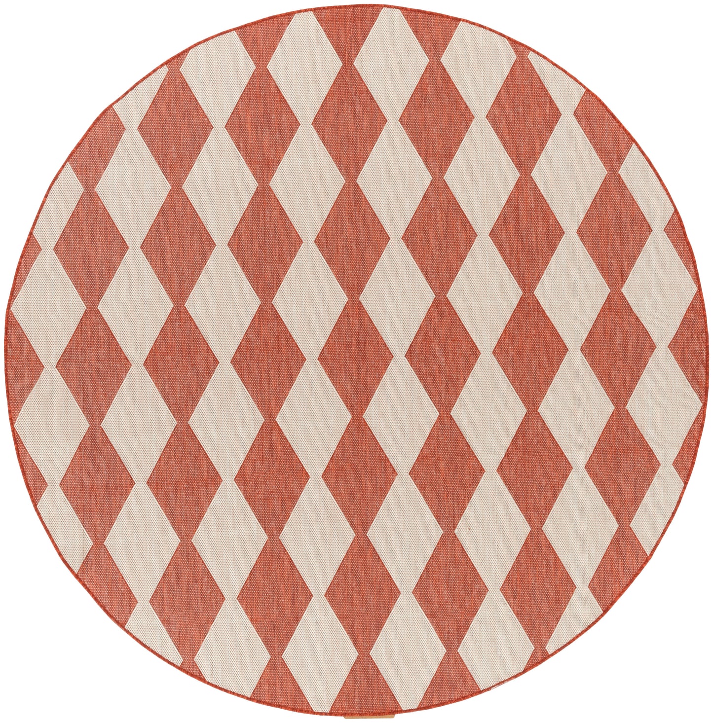 Round rug in rust red and cream diamond harlequin pattern; woven textile with a red stitched edge.