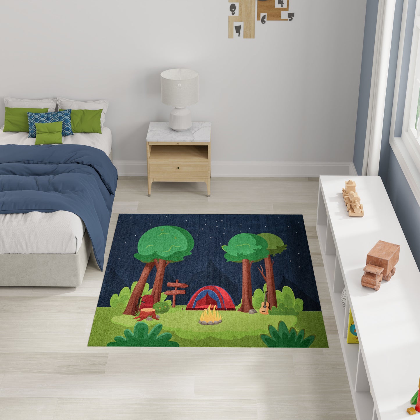 Kids' rug with a camping scene: tall trees, a red tent, a small campfire, and green grass under a dark starry sky.