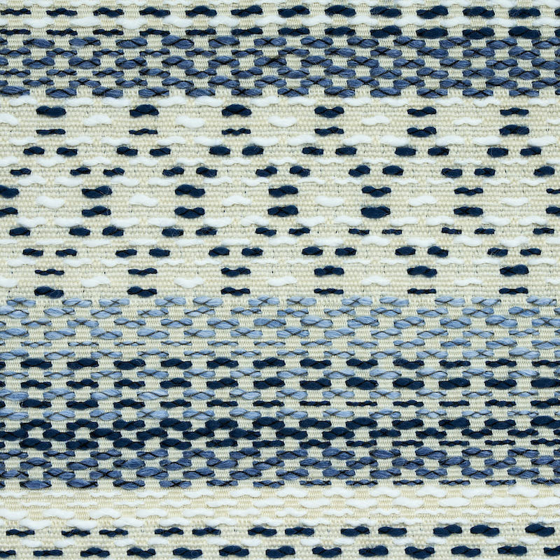 Navy and cream woven fabric with horizontal striped dot pattern; textured textile suitable as rug or throw.