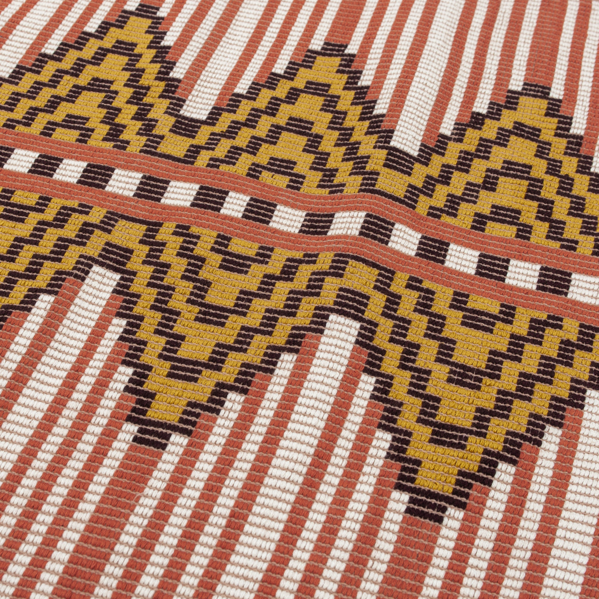Kilim-style woven tapestry with yellow and brown zigzag chevrons, cream and rust stripes; bold tribal motif.