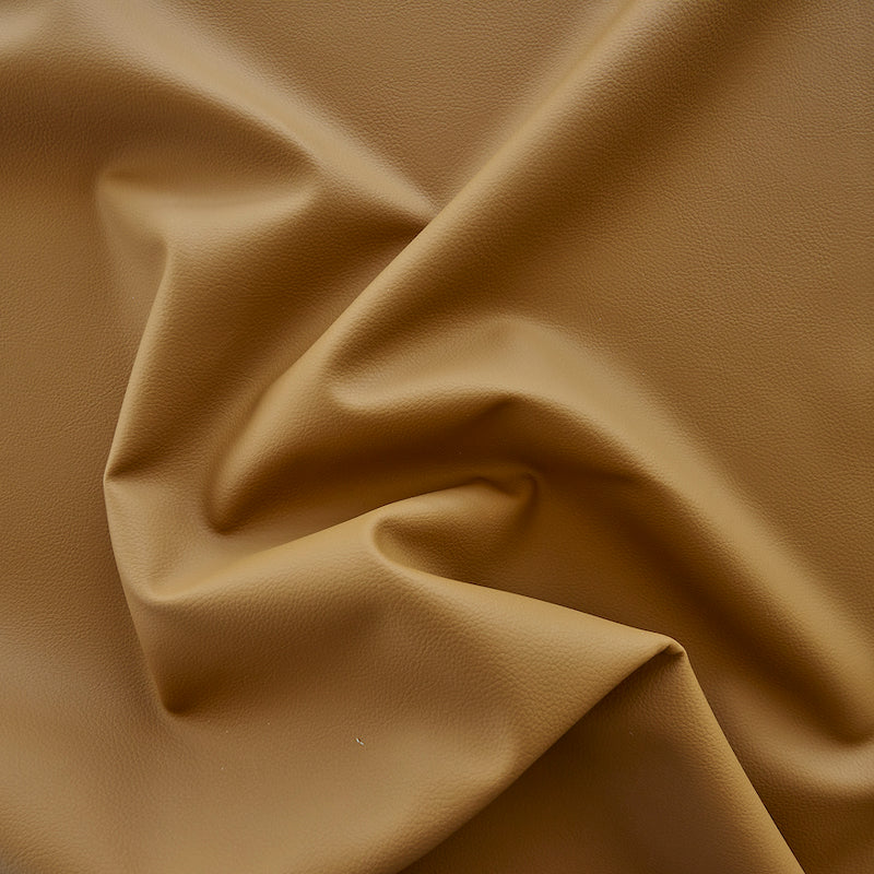 Tan vegan leather with soft drape and subtle grain texture.