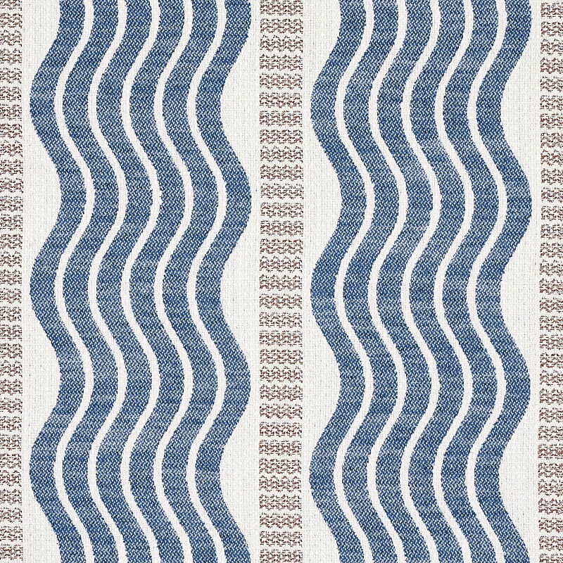 Beige area rug with navy blue wavy vertical stripes and tan dotted borders; coastal geometric textile.