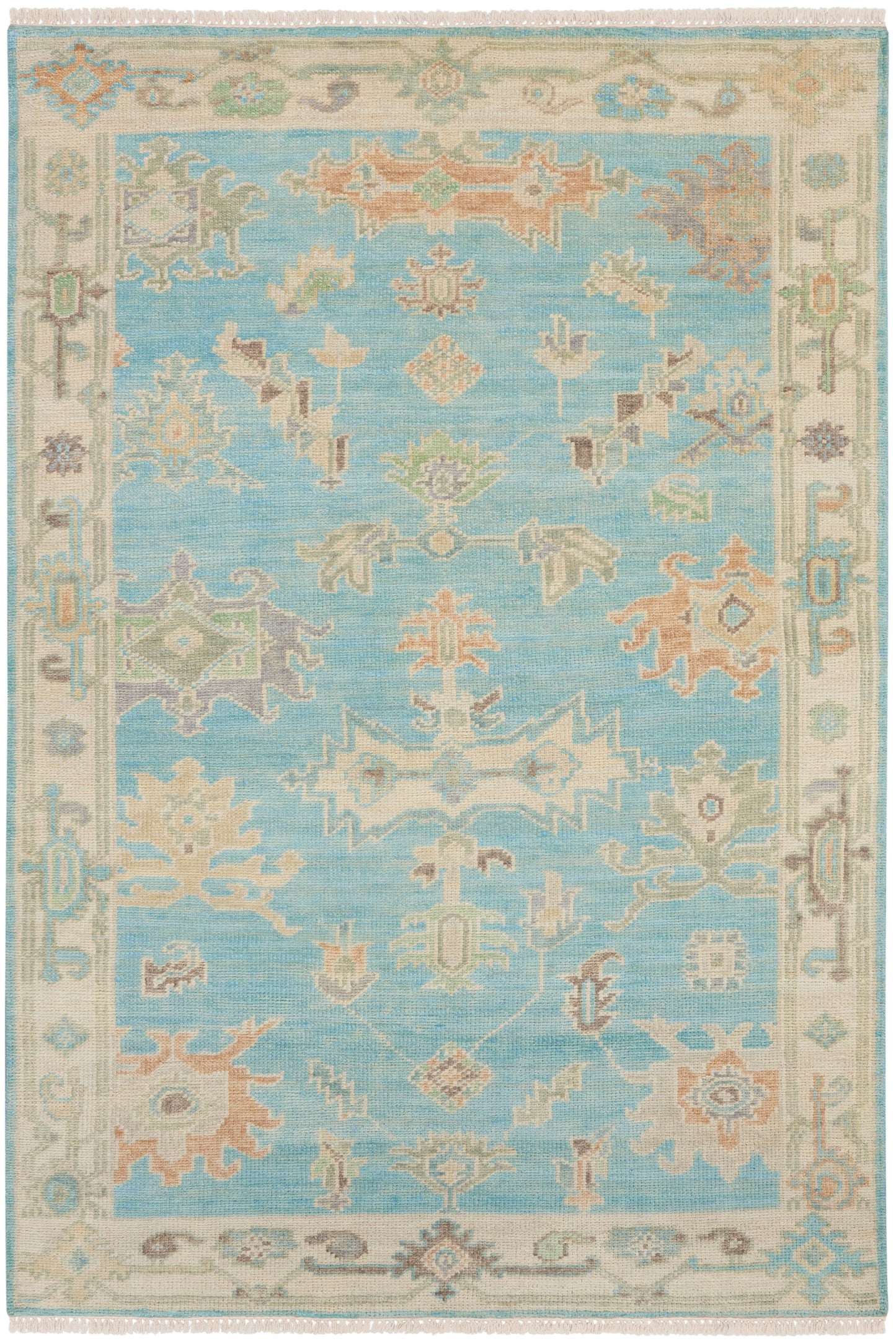 Soft blue oriental rug with pastel floral motifs and ivory border; fringed edges.