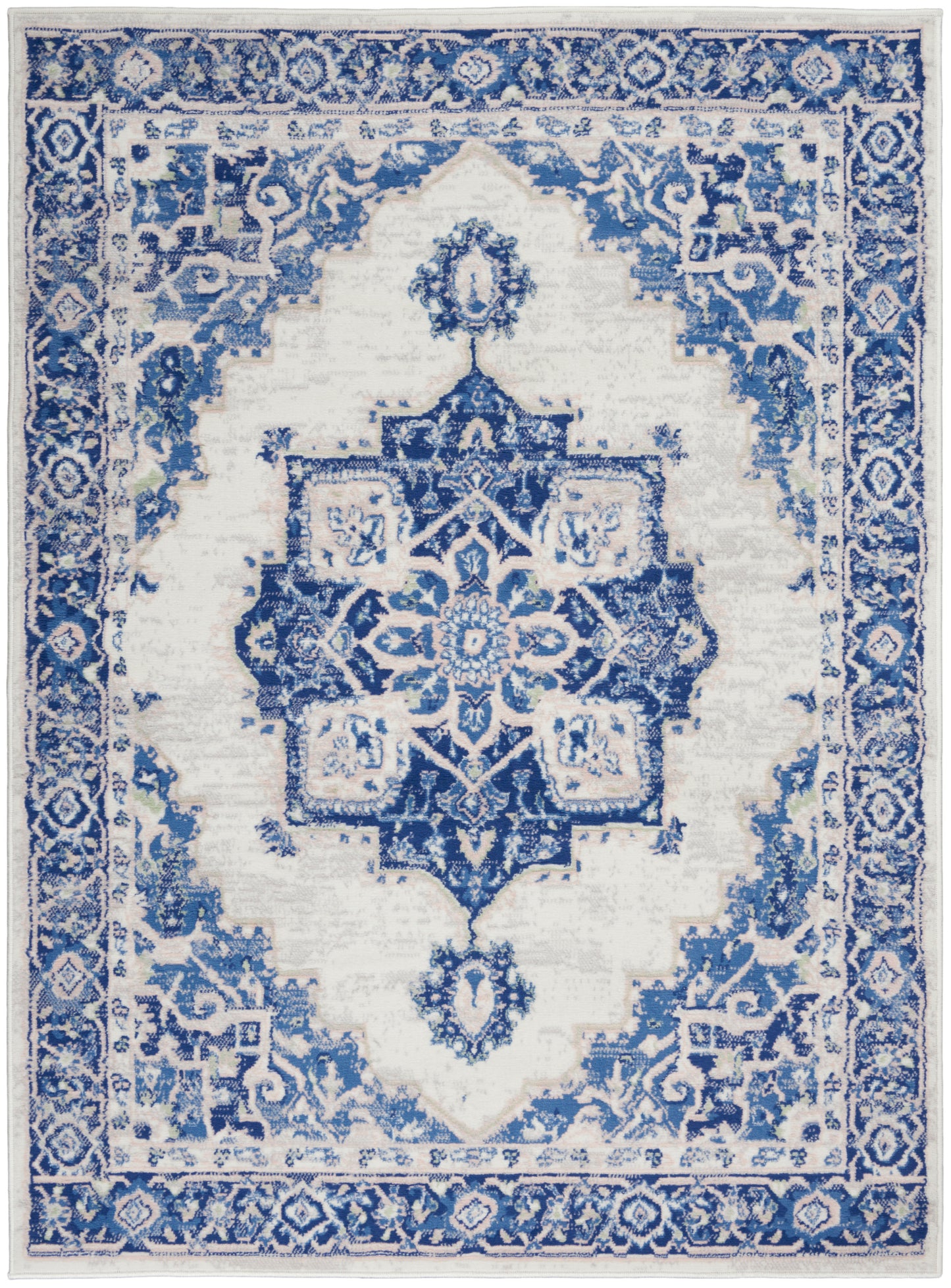 Blue and white oriental area rug with a central star medallion, intricate floral border, rectangular for living room decor.