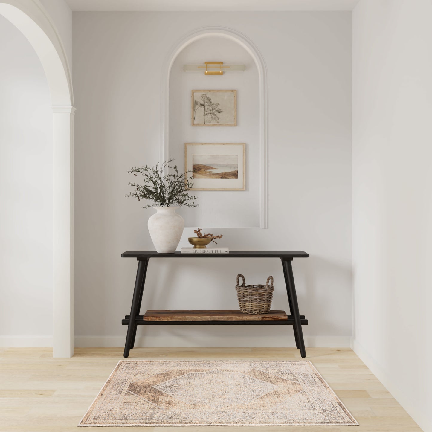 Beige patterned rug on the floor in a room with dark furniture, a vase of greenery, a woven basket, and framed art.