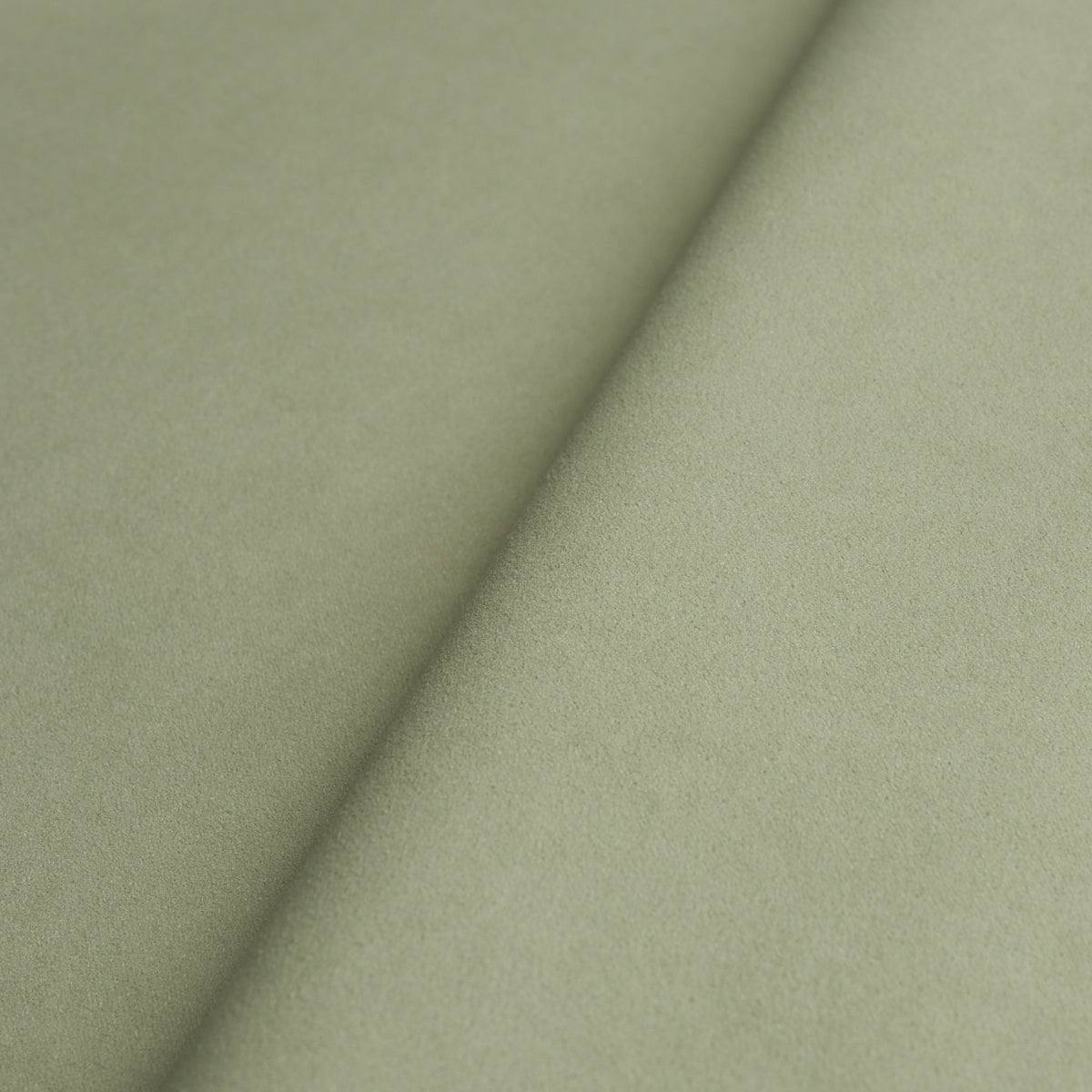 Olive green suede-like fabric with a diagonal crease and soft matte texture.