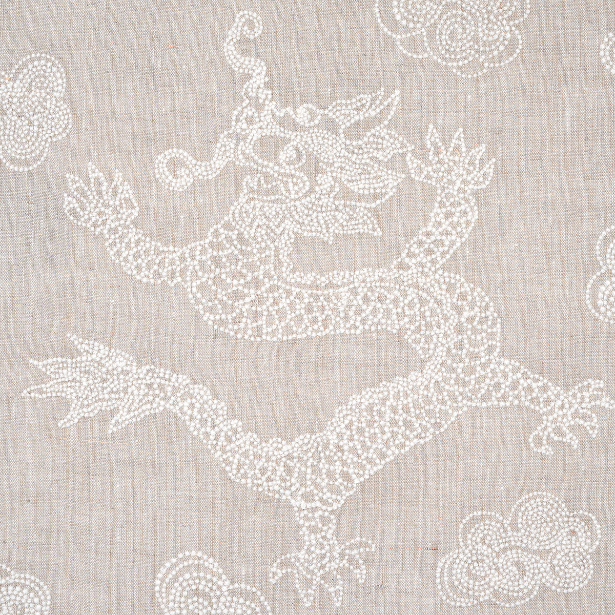 Beige linen fabric featuring white embroidered dragon with clouds; decorative textile design.