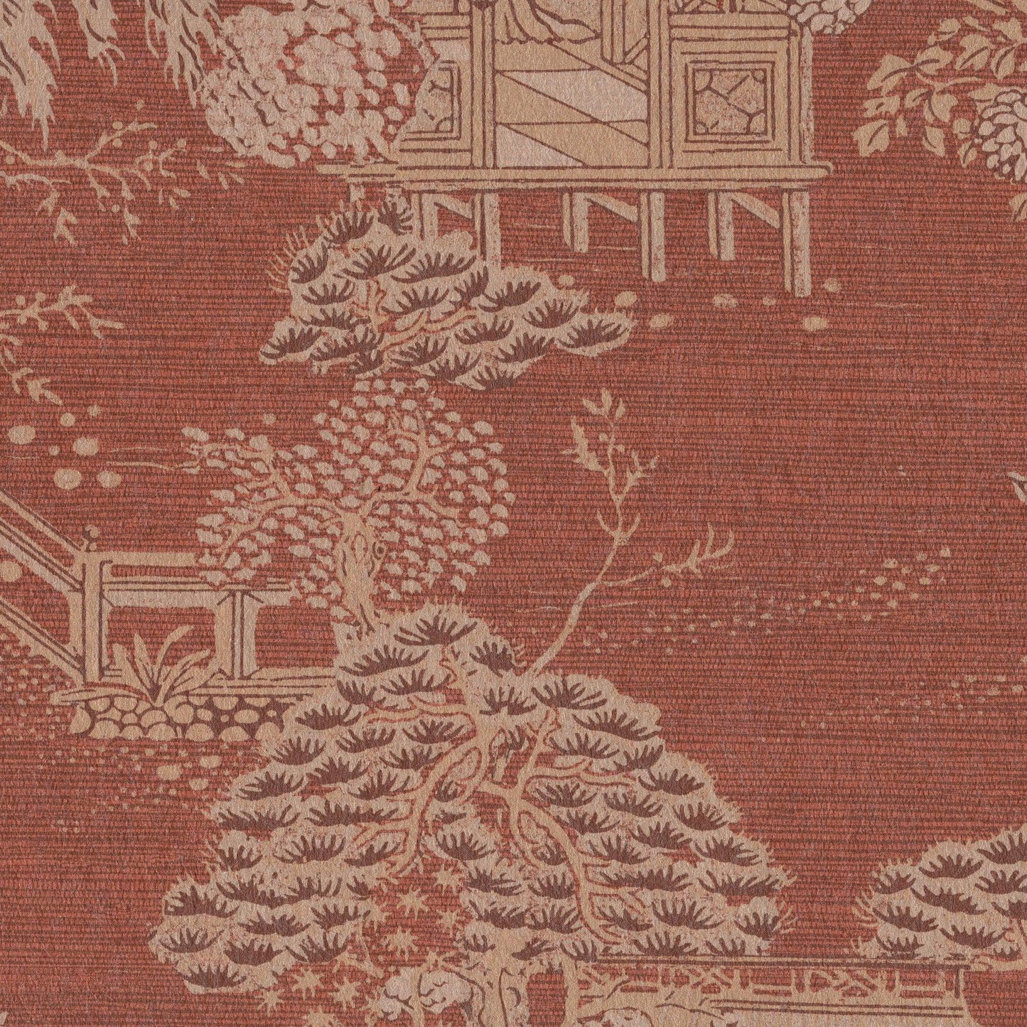 Rust-red upholstery fabric with cream toile pattern featuring trees, a bridge and garden railings.