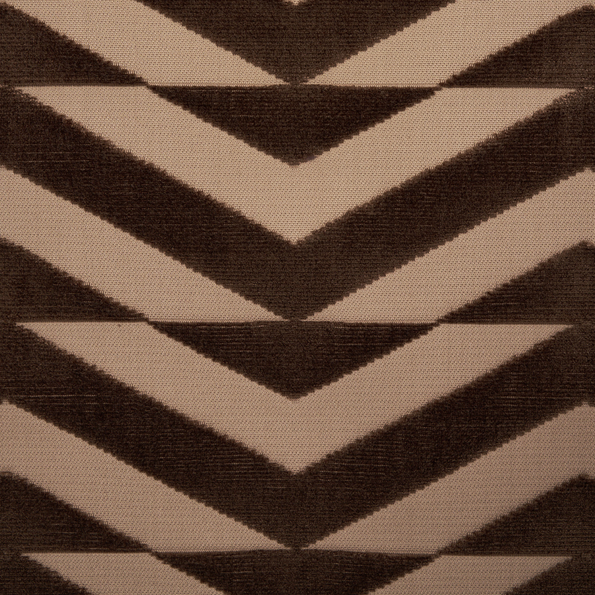 Tan and brown chevron rug pattern in a woven textile with bold zigzags.