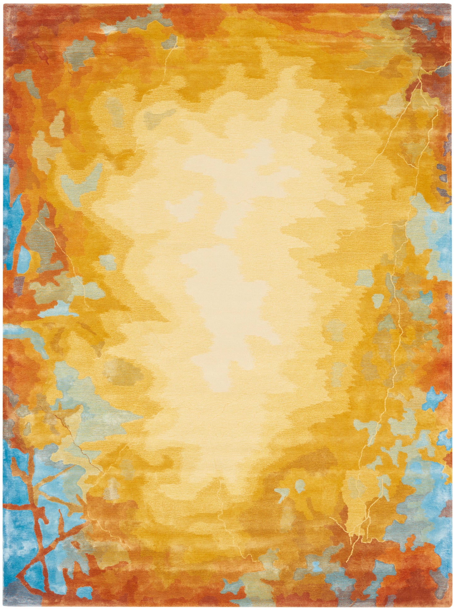 Abstract area rug with warm amber-to-gold gradient, cream center, and blue accents along the edges.