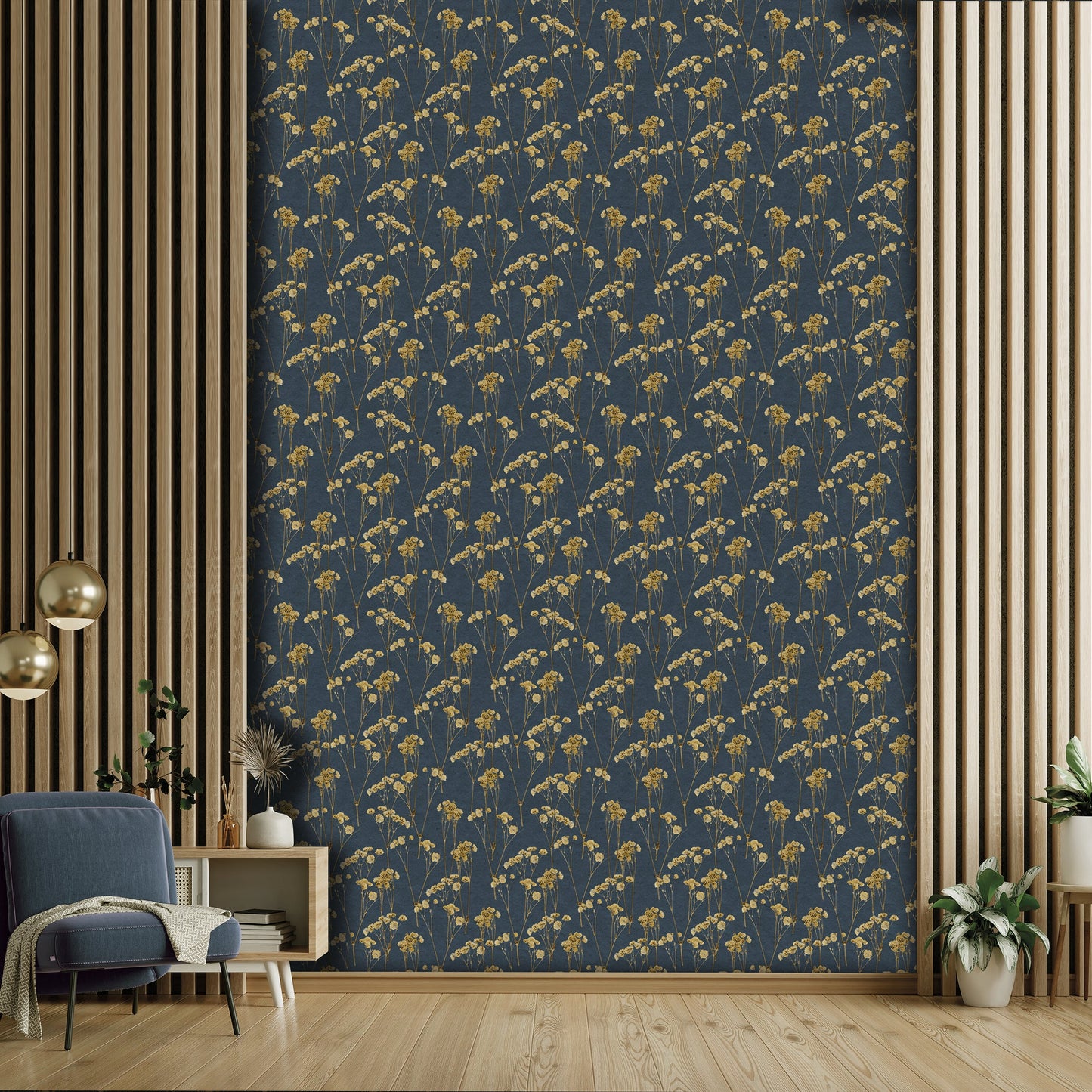 Dark navy wallpaper with a gold botanical pattern framed by vertical wood slats; a blue lounge chair, plants, and wooden furniture.