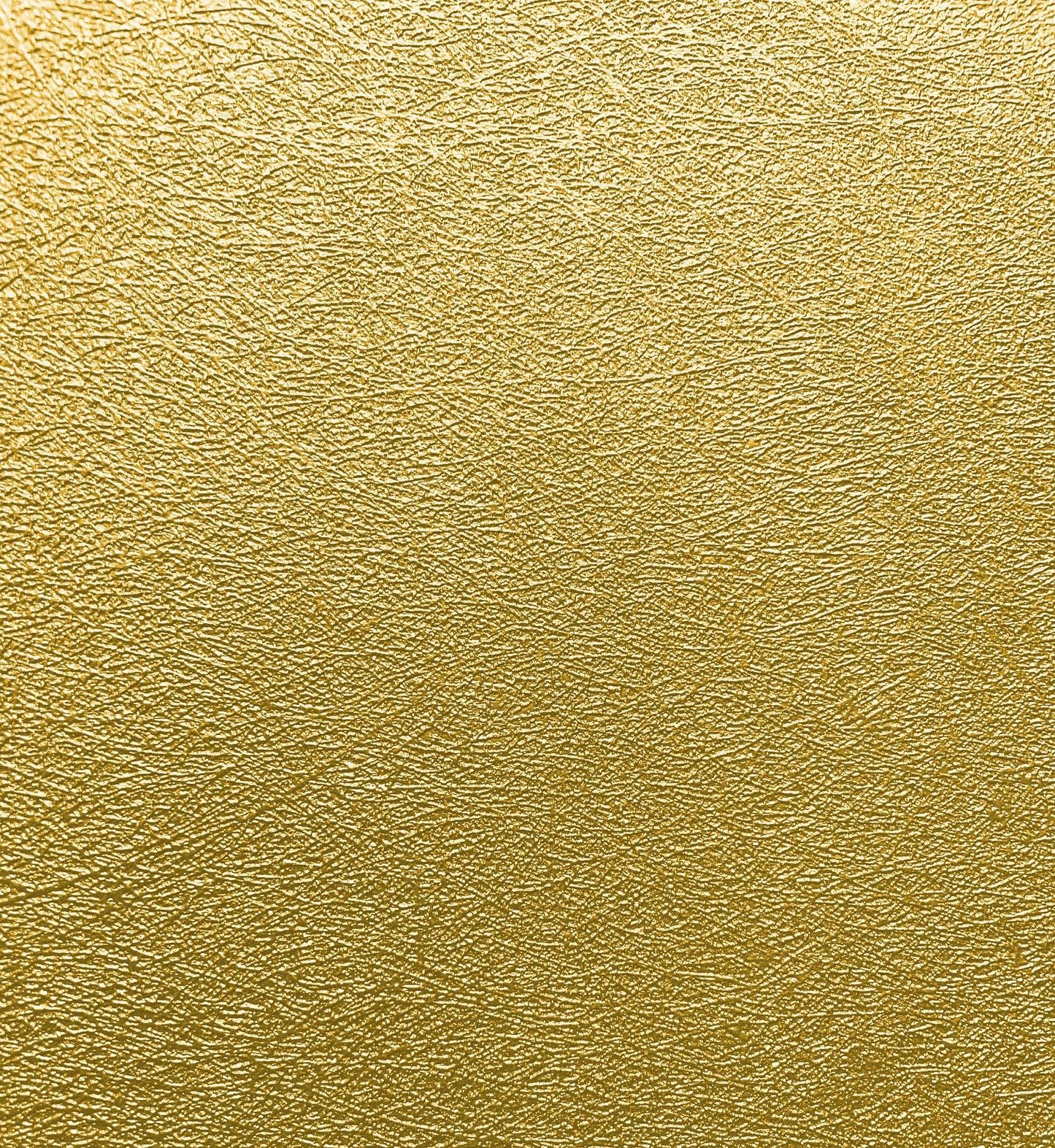 Gold metallic faux textile fiber wallpaper with fine grain texture and warm backdrop.