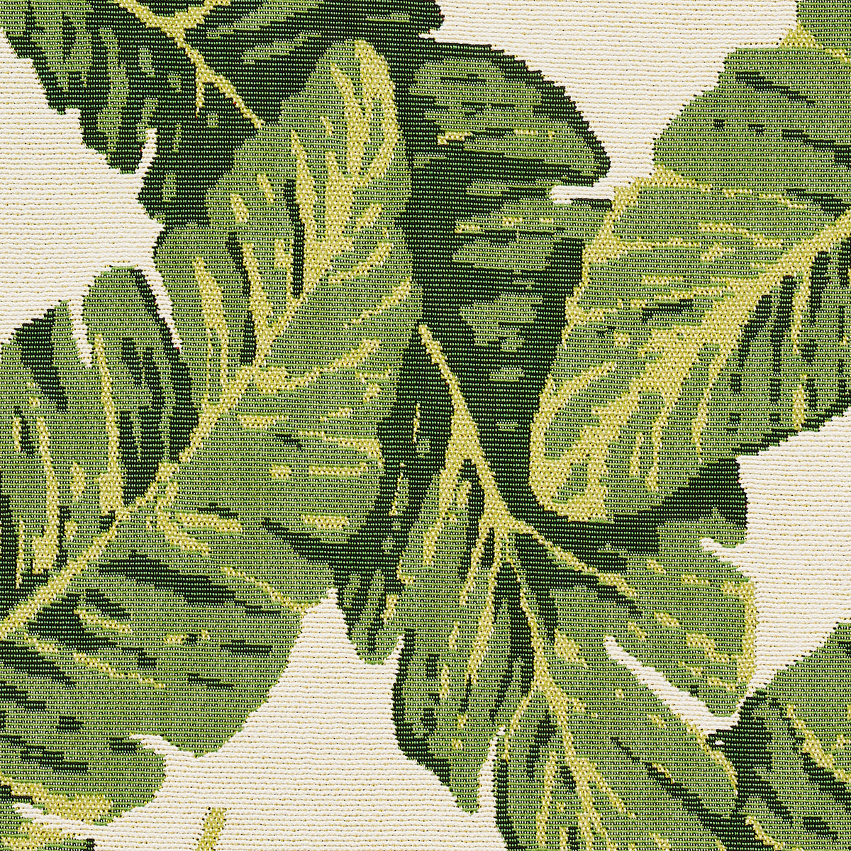 Botanical tapestry fabric with large green tropical leaves on beige background; woven texture