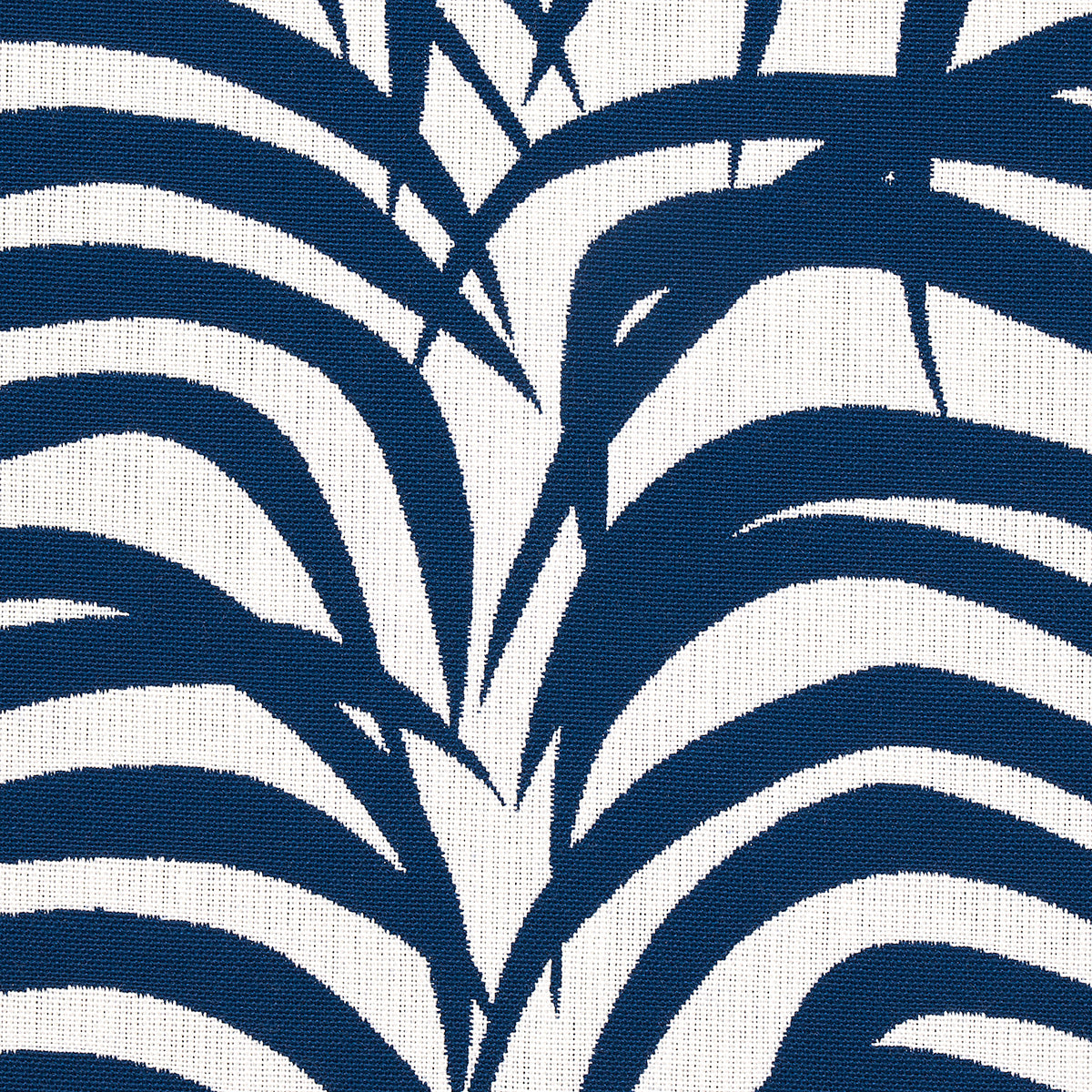 Bold navy palm-leaf botanical print on white fabric; curved stripe pattern suitable for curtains or cushions.