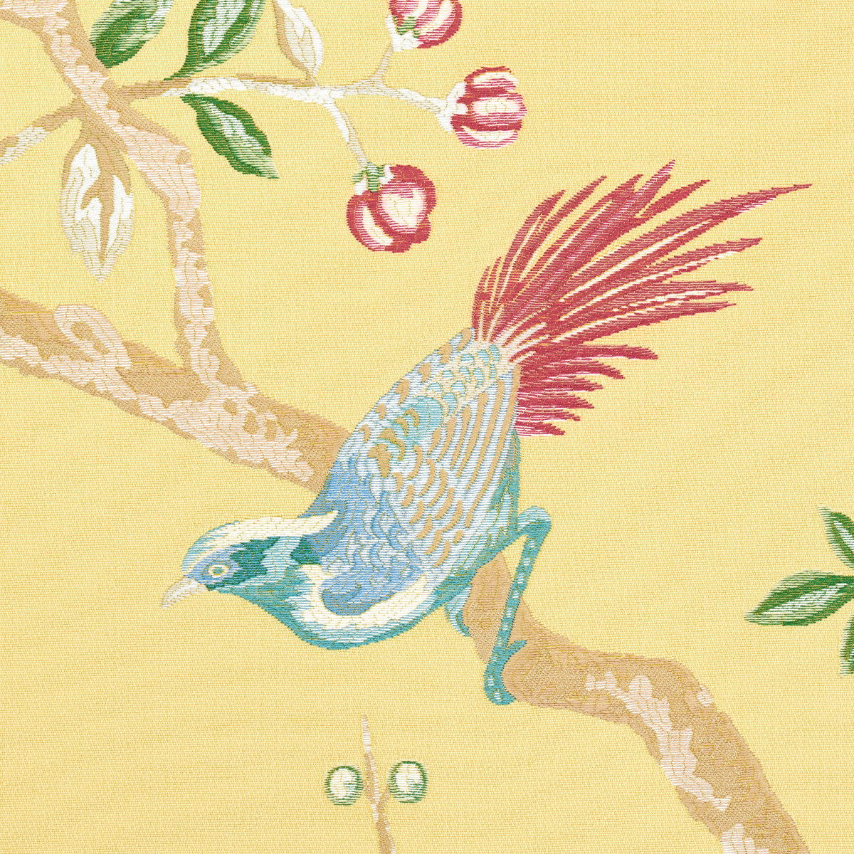 Blue-green bird with maroon tail perched on a branch with green leaves and red berries on yellow fabric pattern.