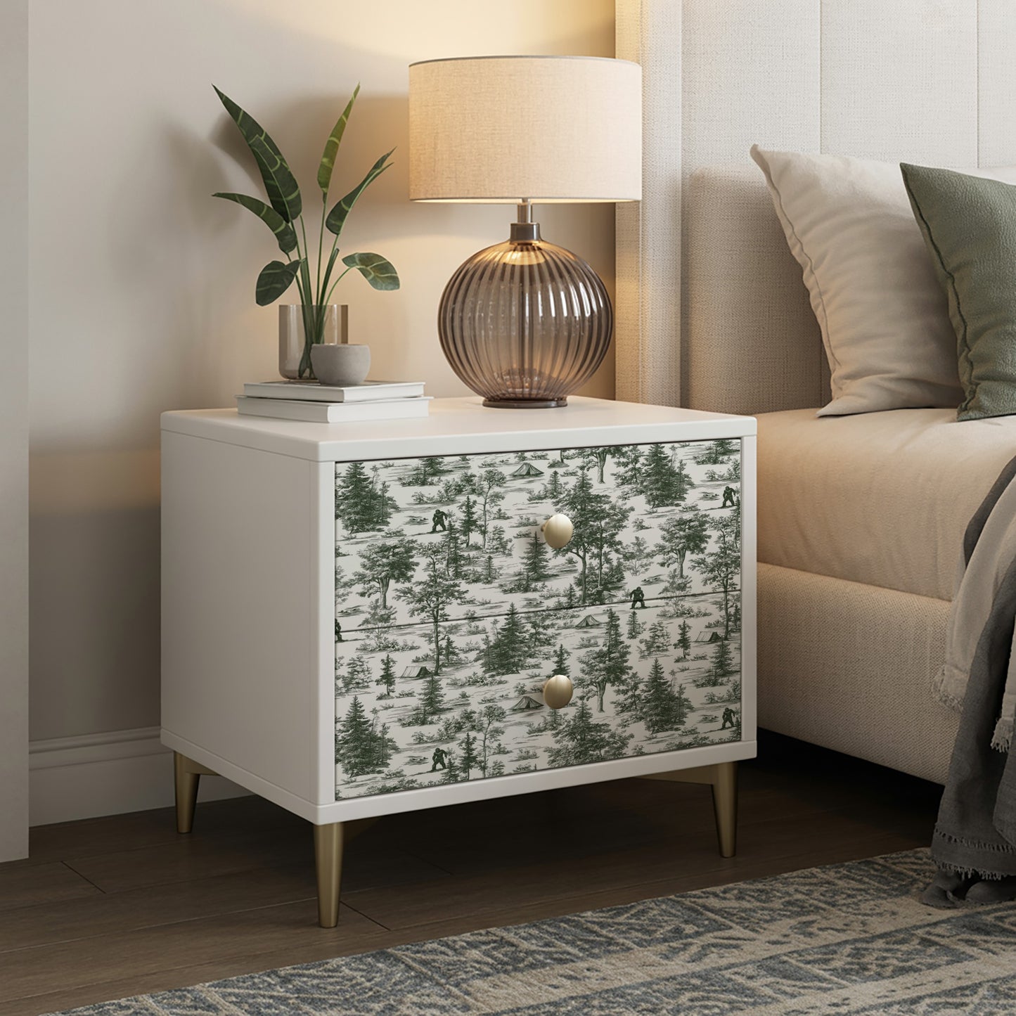 Peel-and-stick wallpaper in sage green with a novelty toile landscape pattern.