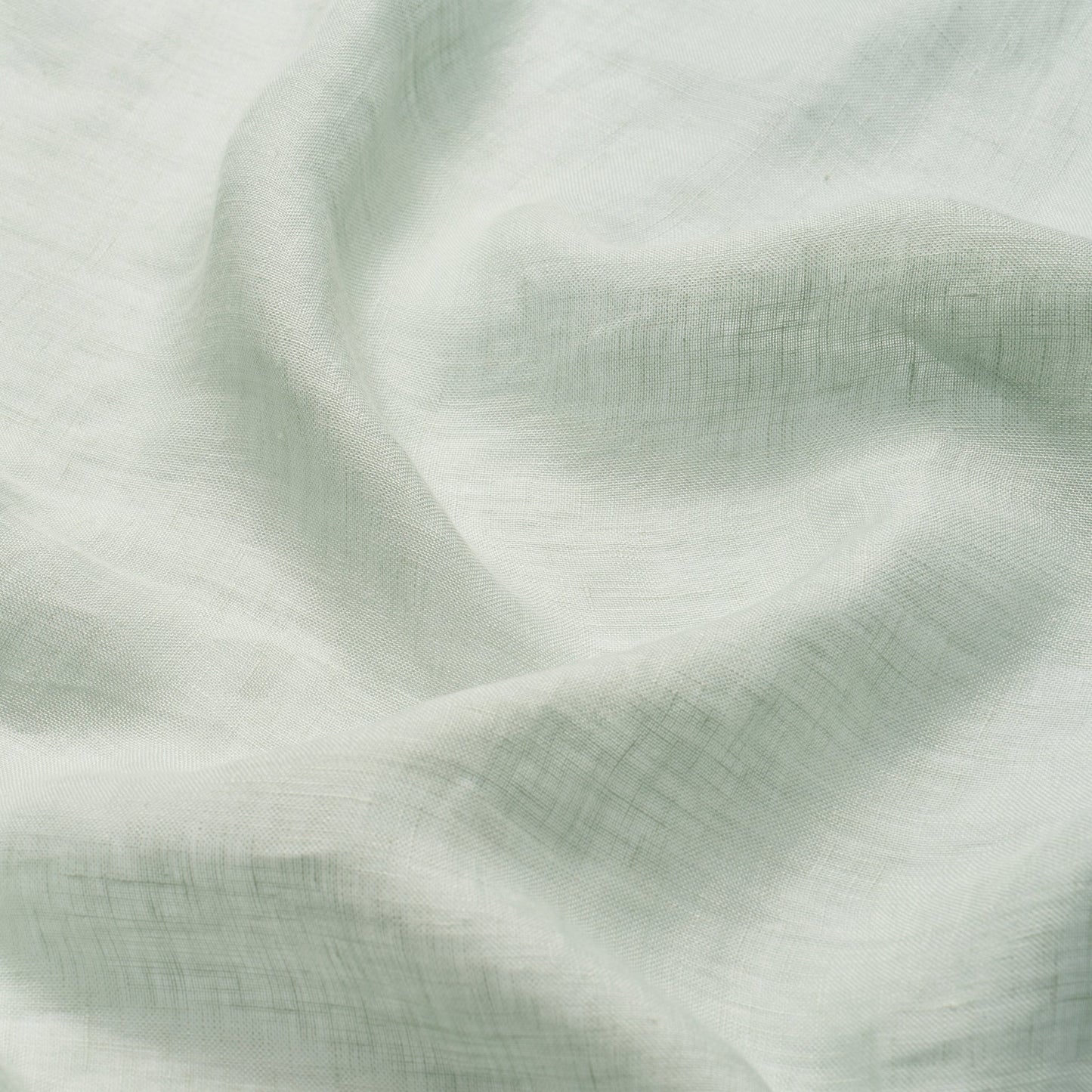 Mint green linen-like fabric with soft drape and subtle weave texture, ideal for clothing or home decor.