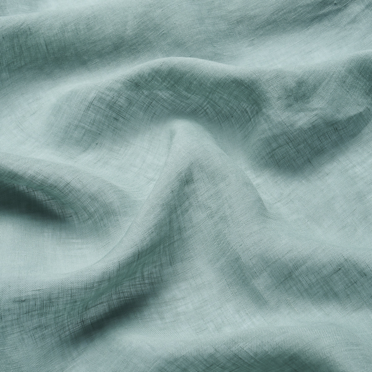Mint green linen fabric with gentle folds & visible crosshatch weave, lightweight drape.