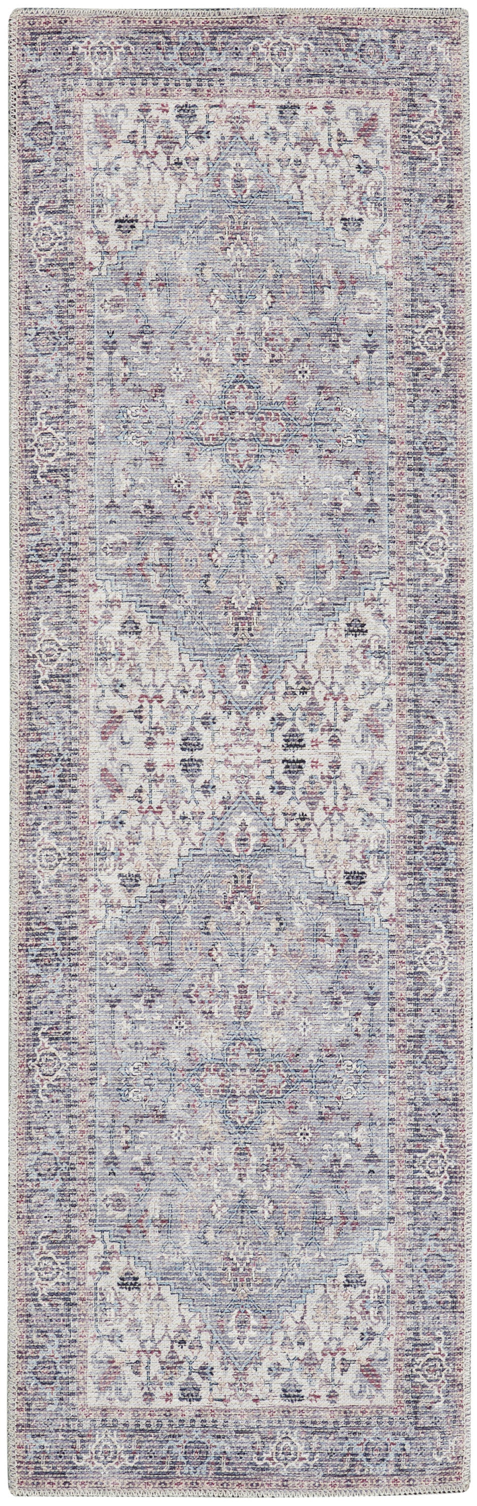 Vintage-style Persian rug runner in pale blue, cream, and dusty pink, with central medallion and intricate floral border.