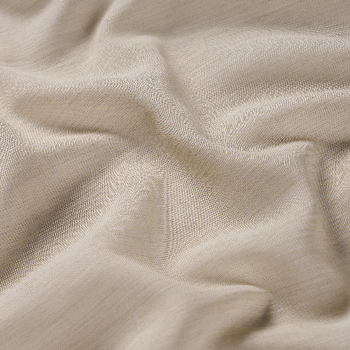 Beige soft knit fabric with gentle folds and subtle rib texture, cozy & versatile.