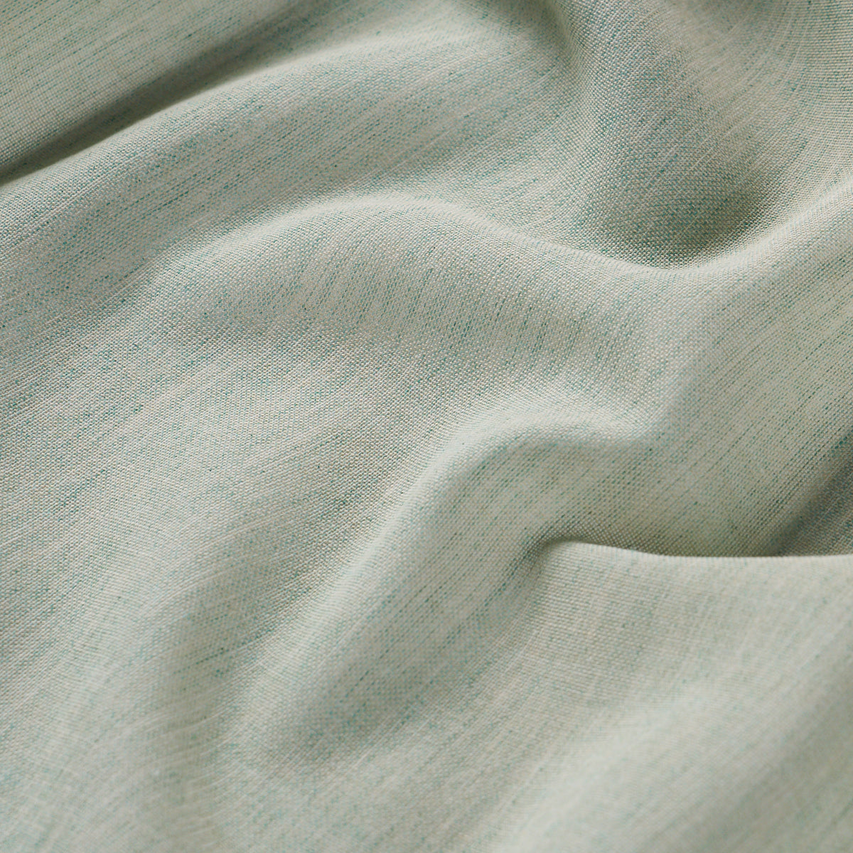 Mint green knit jersey fabric with soft drape and subtle rib texture, ideal for light garments.