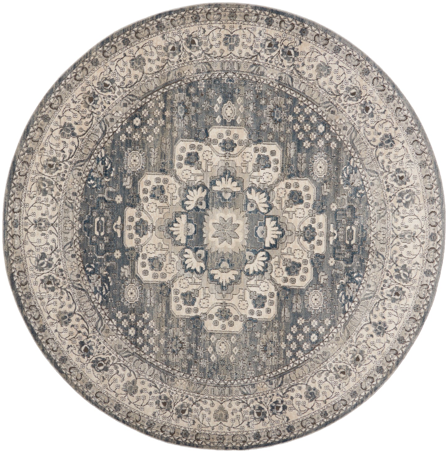 Round oriental rug in navy and ivory with floral medallion and ornate border.