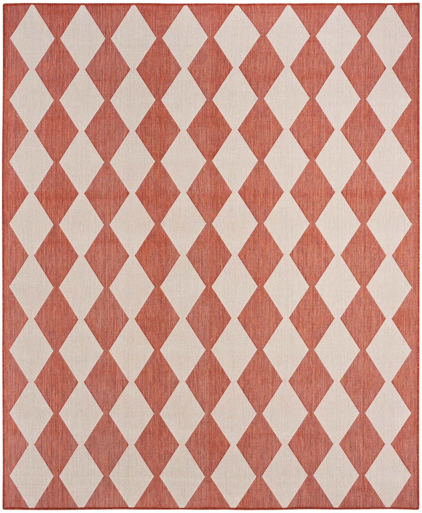 Rectangular rug with orange & cream diamond harlequin pattern; woven texture.