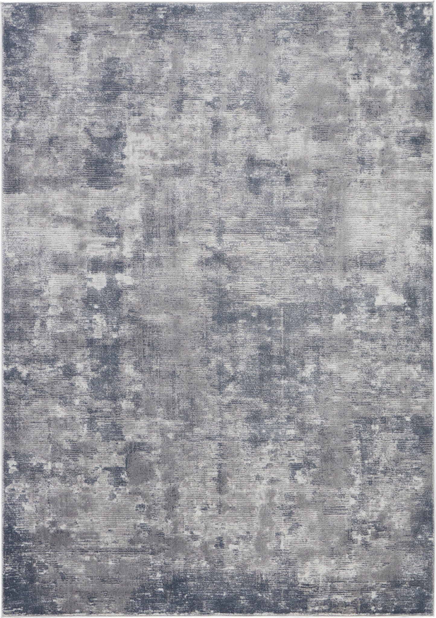 Rectangular abstract area rug in blue-gray and light gray tones with a distressed pattern and soft texture.
