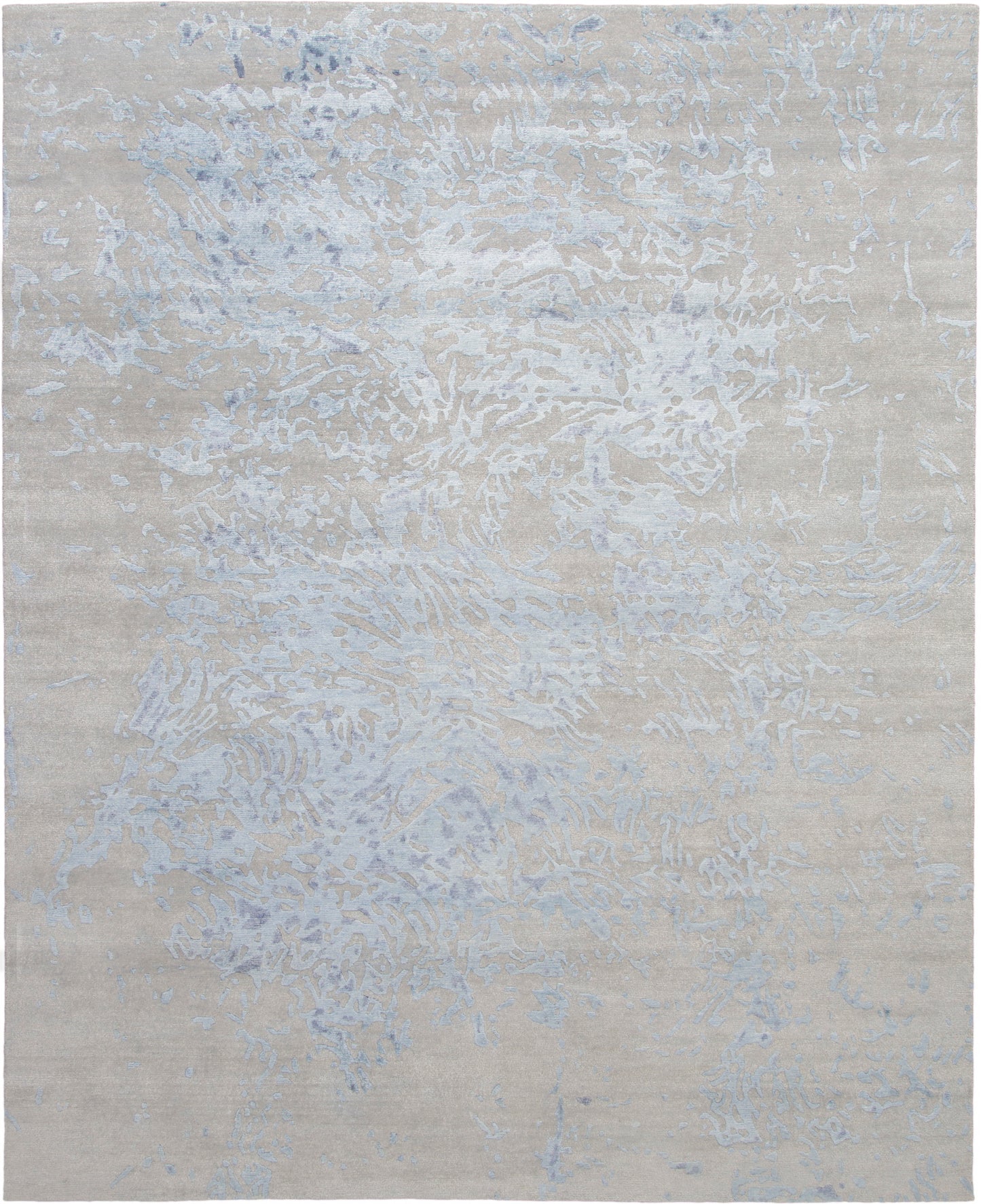 Beige abstract area rug with pale blue-gray marbled veining.