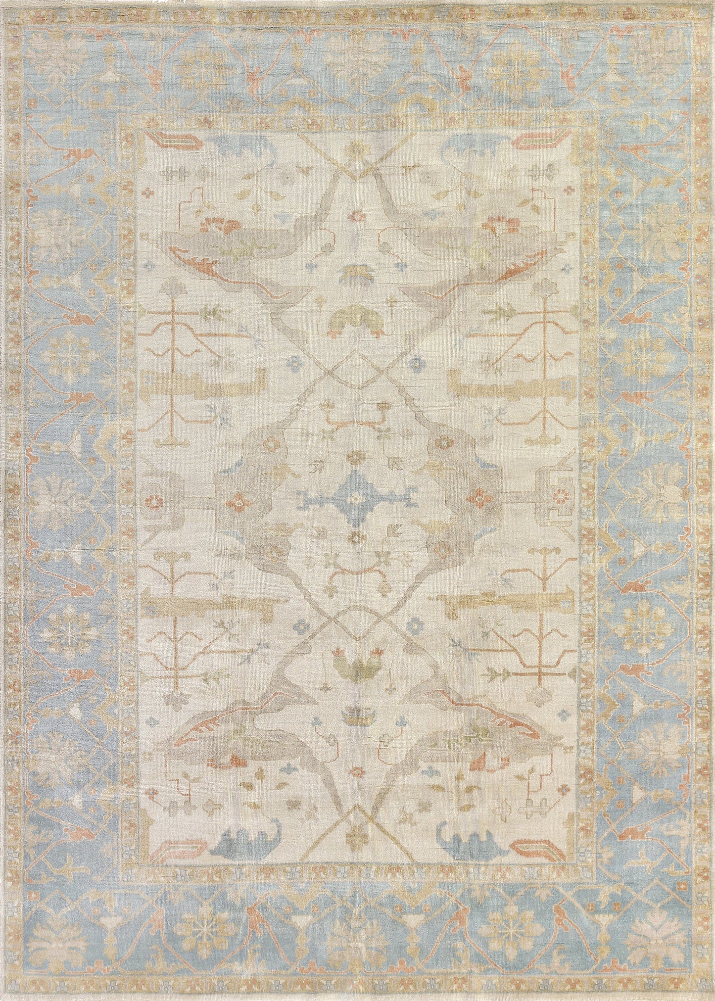 Light blue and cream area rug featuring intricate floral and geometric patterns in soft pastel tones, ideal for elegant decor.
