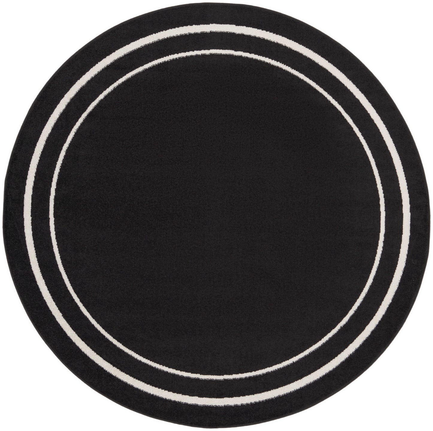 Round black rug with two white circular bands.