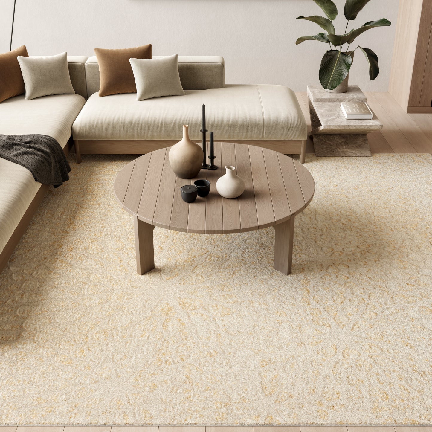 Cream-colored modern rug (8' x 10') in a living room with a round wooden coffee table, ceramic vases and candles, and a beige sectional sofa with taupe cushions.