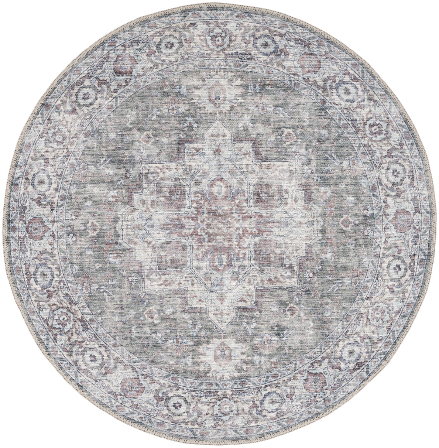 Round oriental rug with distressed medallion center in muted teal-gray, ivory and rose tones, bordered with floral pattern.