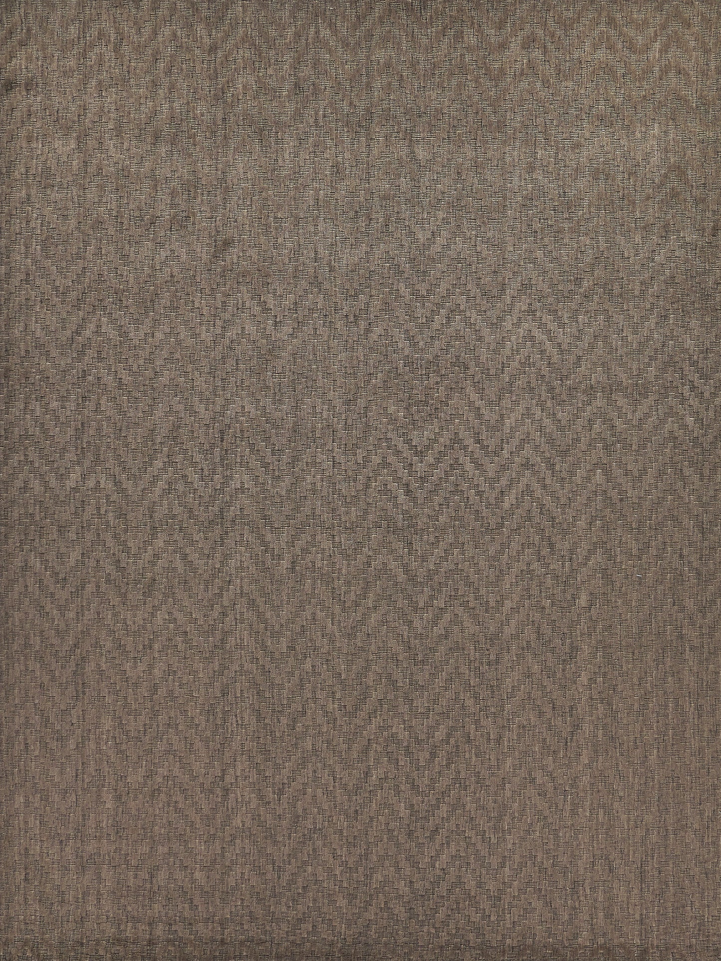 Textured brown and cream zigzag rug with a woven design; handloomed rectangle.