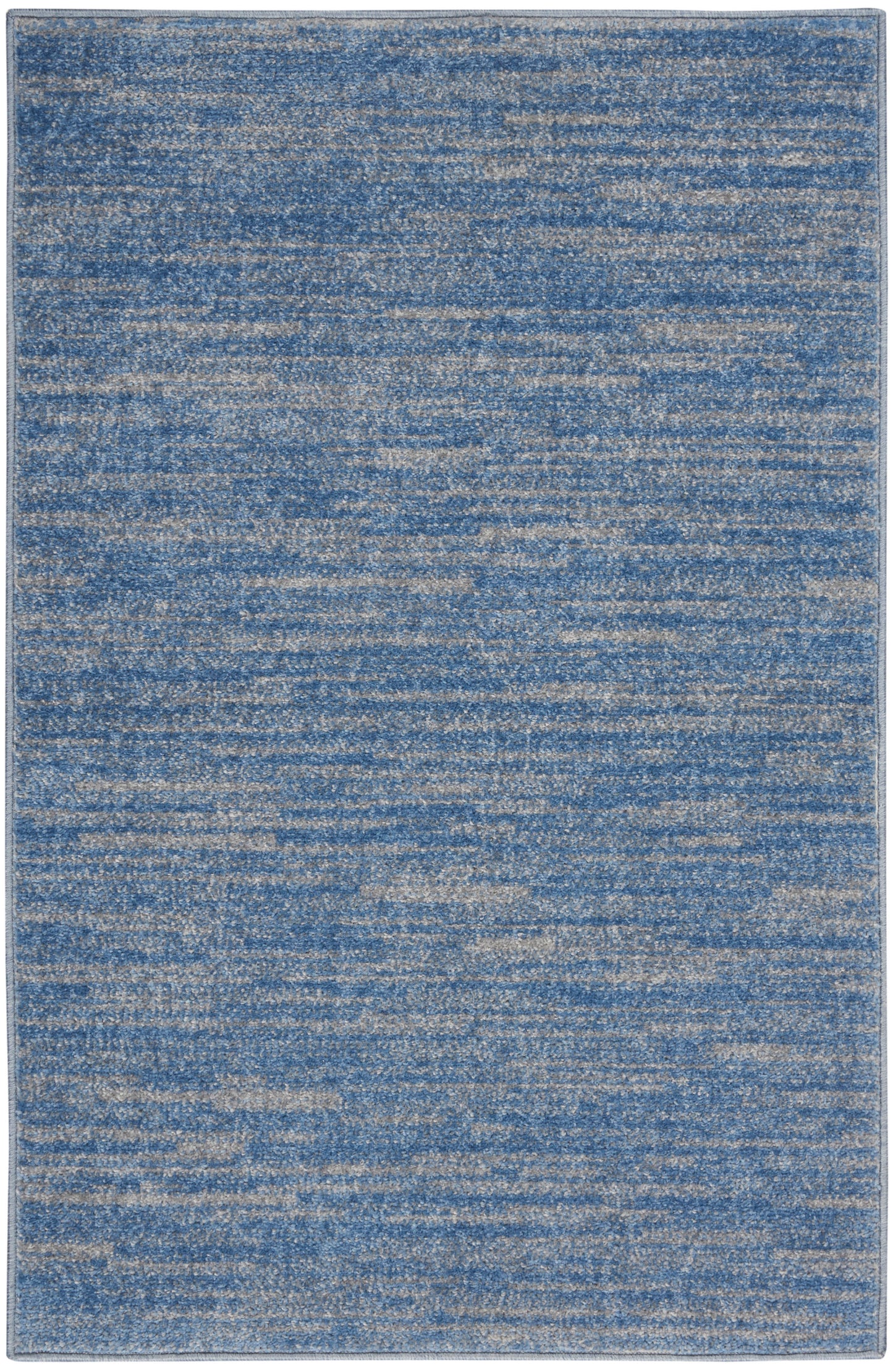 Rectangular blue distressed outdoor rug with beige speckled texture; modern abstract pattern, low-pile.