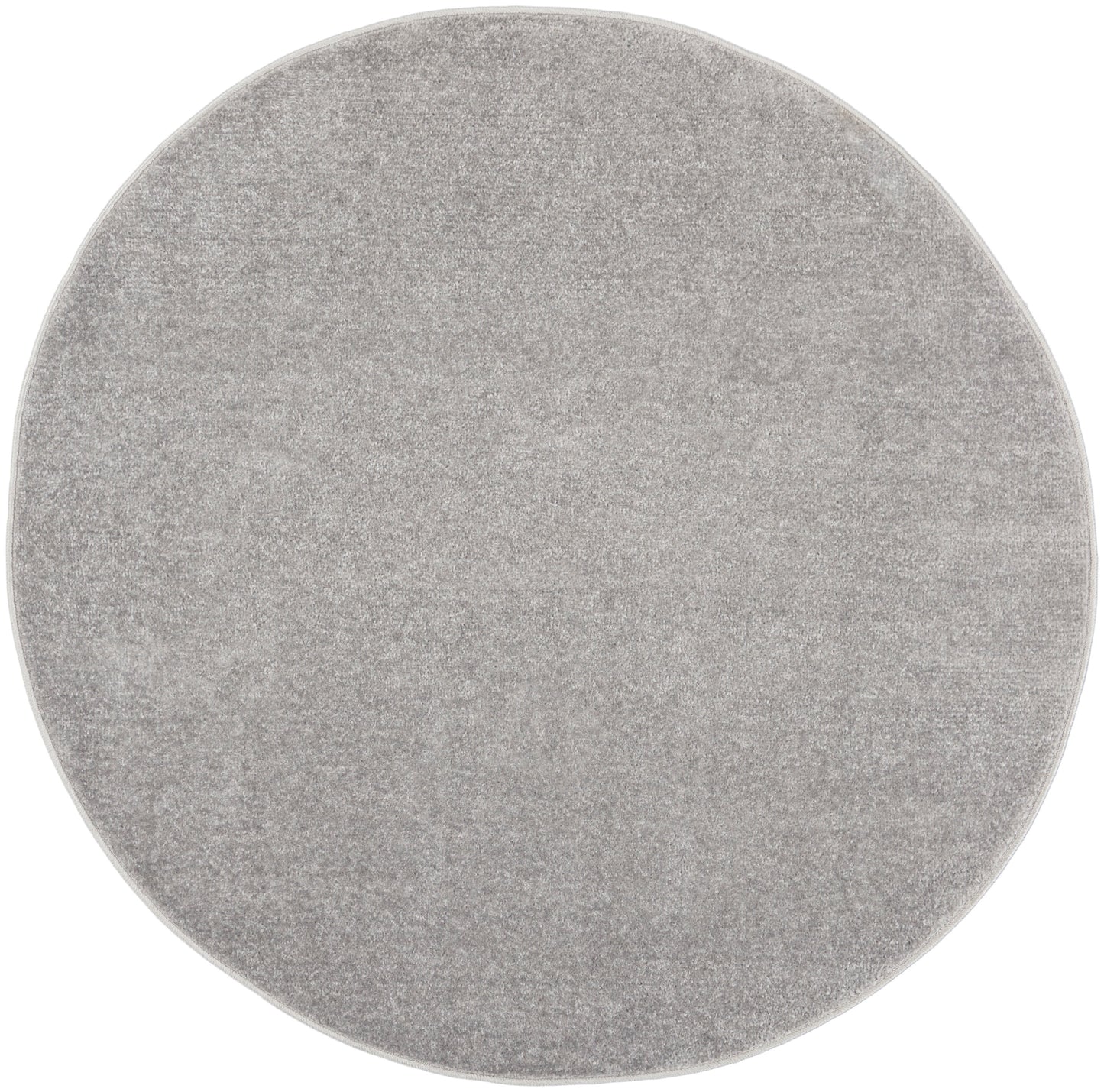 Round light gray outdoor rug with plush pile; 4' diameter, modern minimalist decor.