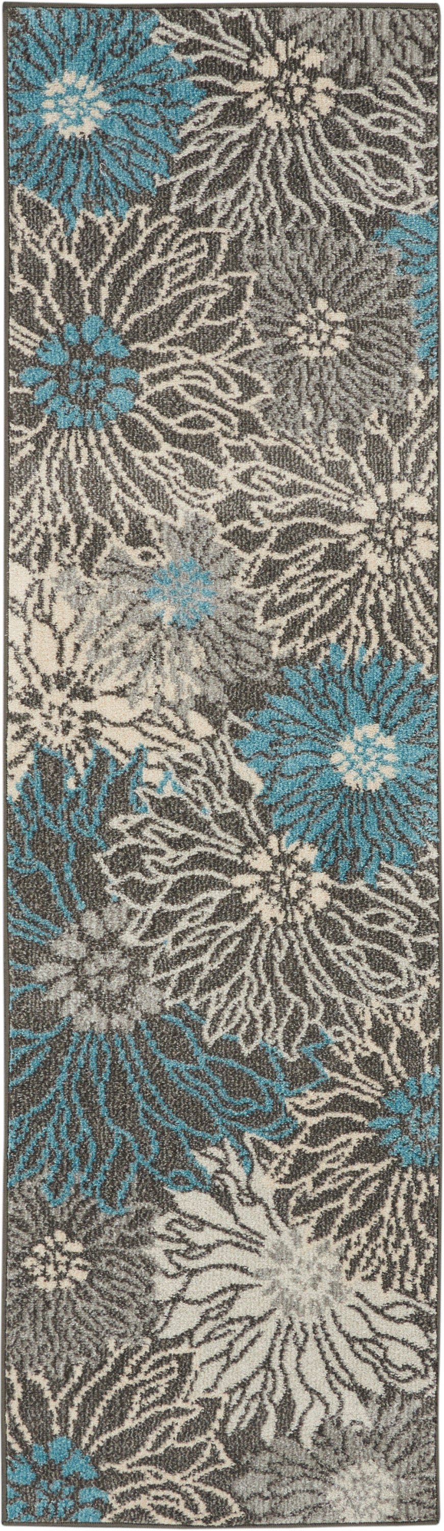 Rectangular shag runner rug with gray and beige floral pattern and teal blue accents.