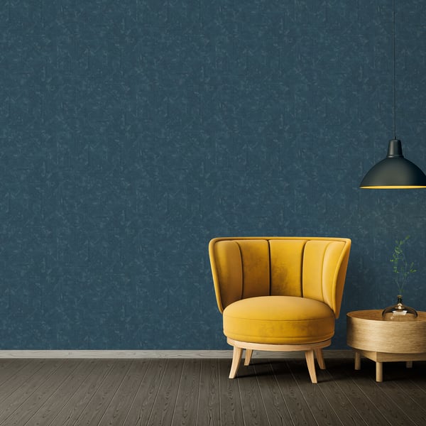 Blue distressed geometric motif wallpaper on wall.